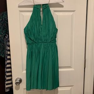 Kelly green halter style dress with gold chain detail